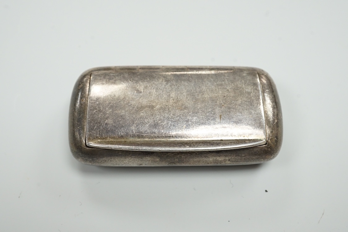 A late Victorian repousse silver navette shaped dish, by Charles Edwards, London, 1894, 25.7cm, with engraved monogram and date, together with a pair of mid 18th century silver sugar nips, an early 19th century silver vi